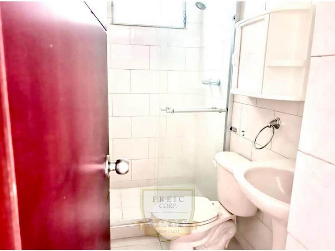 Modern secure apartment lobby with seating police flag security access Central Park Towers Panama City