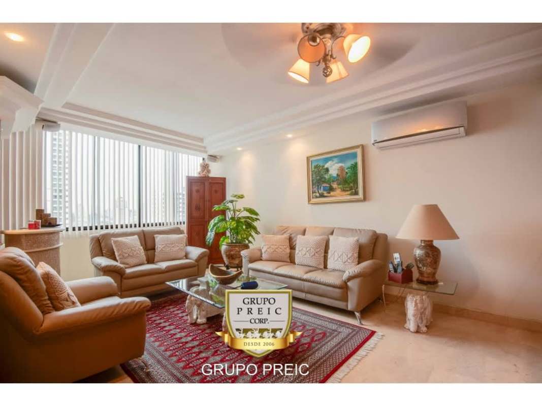 Elegant dining space with panoramic windows in penthouse PH Plaza Real San Francisco