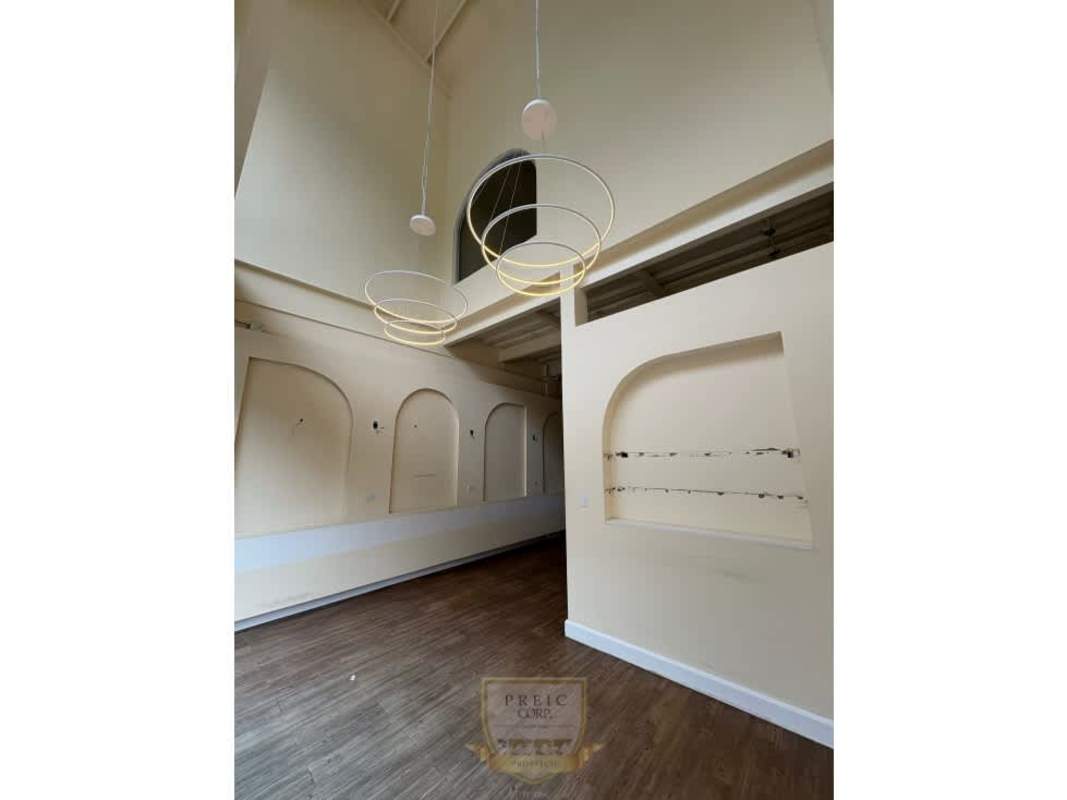 Contemporary commercial interior with vaulted ceilings and pendant lights for rent Plaza San Francisco Panama