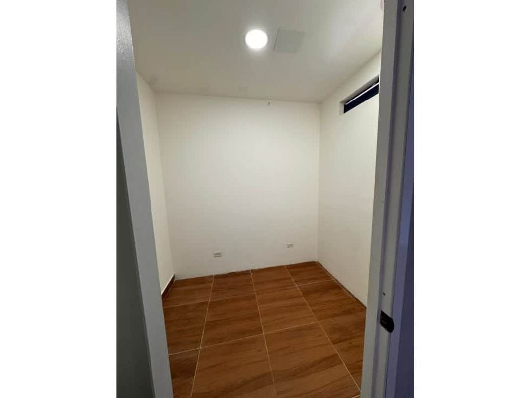 Small storage space with white walls and small window in commercial property Panama City