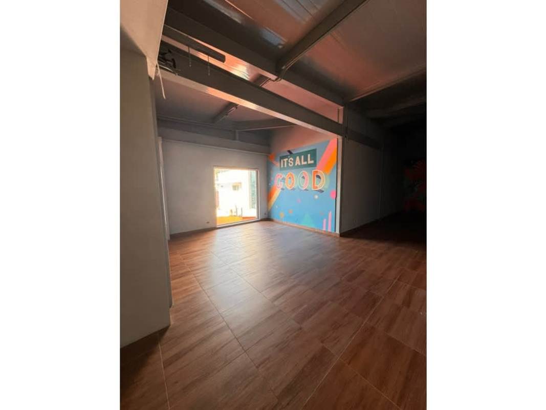 Open commercial space interior with mural and natural light San Francisco Plaza Panama City