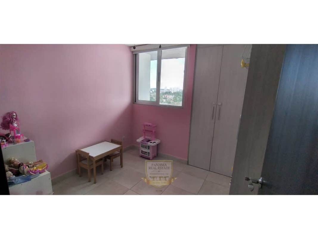 Kids bedroom pink walls built-in wardrobe city view PH Alegría Panama