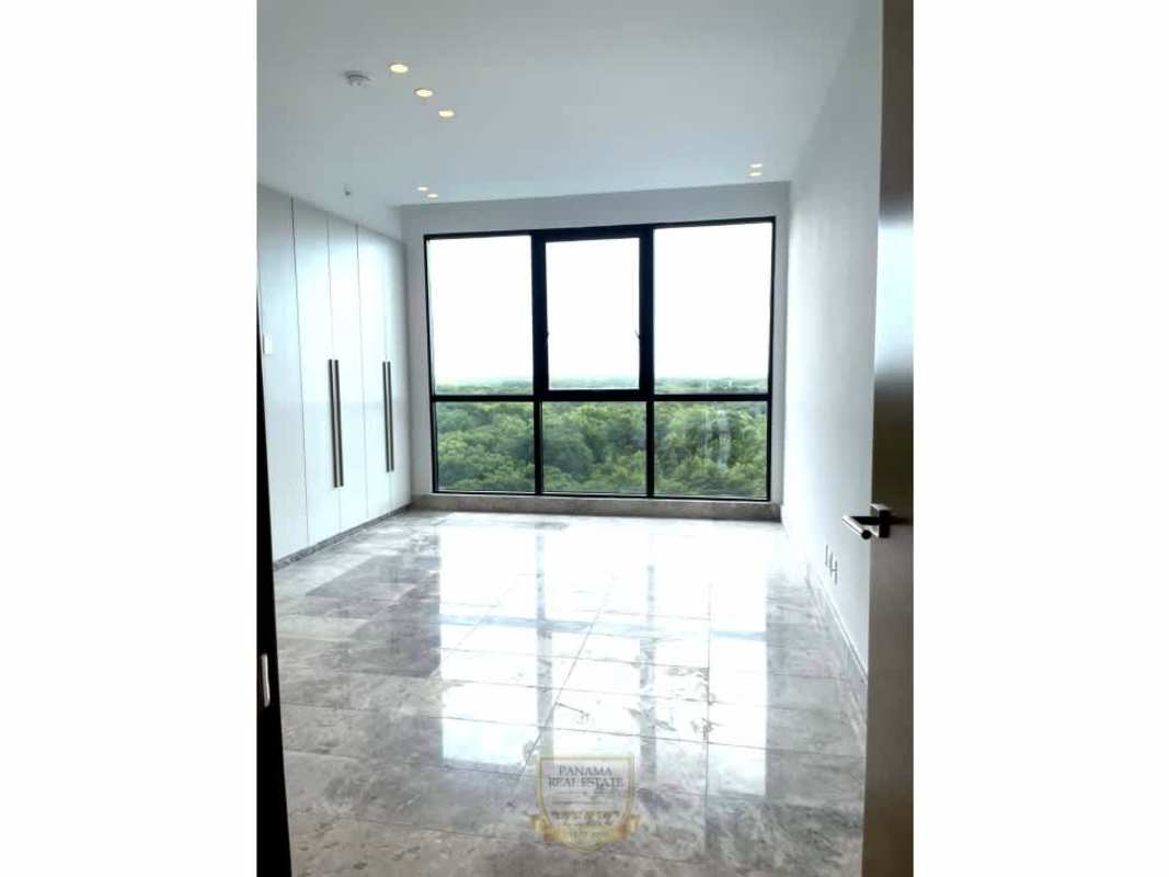 Modern bedroom with marble floors and window view towards golf and gardens in Santa María