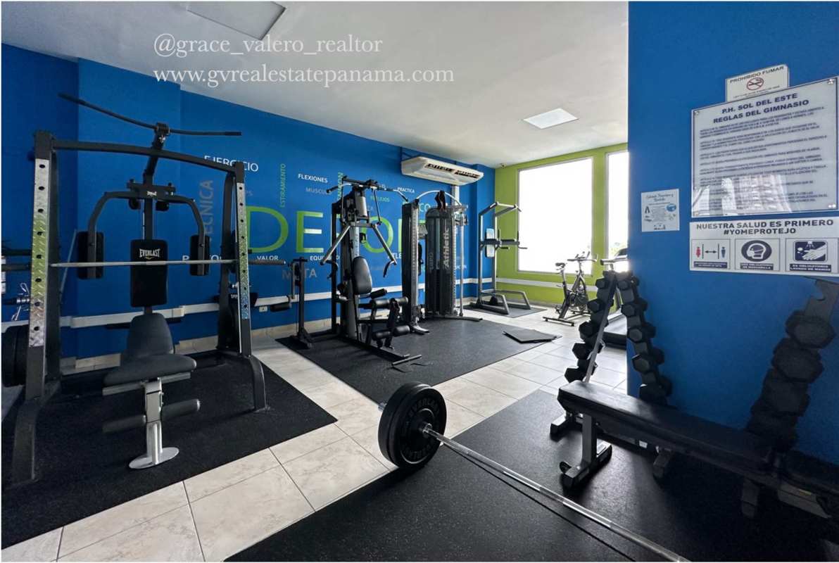 Fully equipped fitness gym with weight machines and cardio equipment in PH Sol del Este Panama City