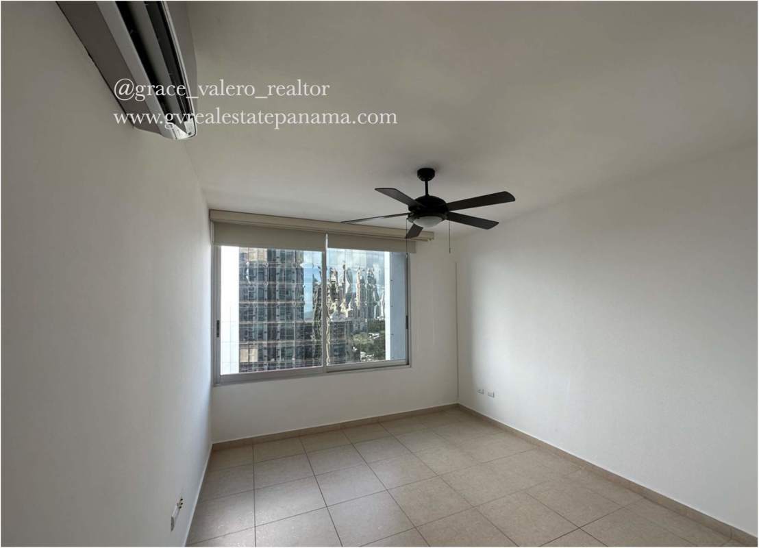 Outdoor swimming pool with palm trees and lounge chairs in PH Sol del Este Costa del Este Panama City