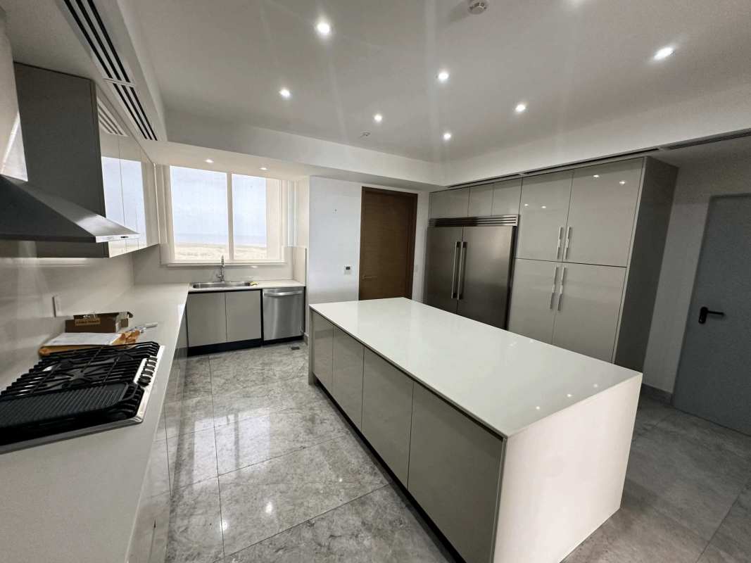 Luxury kitchen with marble island, stainless appliances and golf view Empire Condo Panama