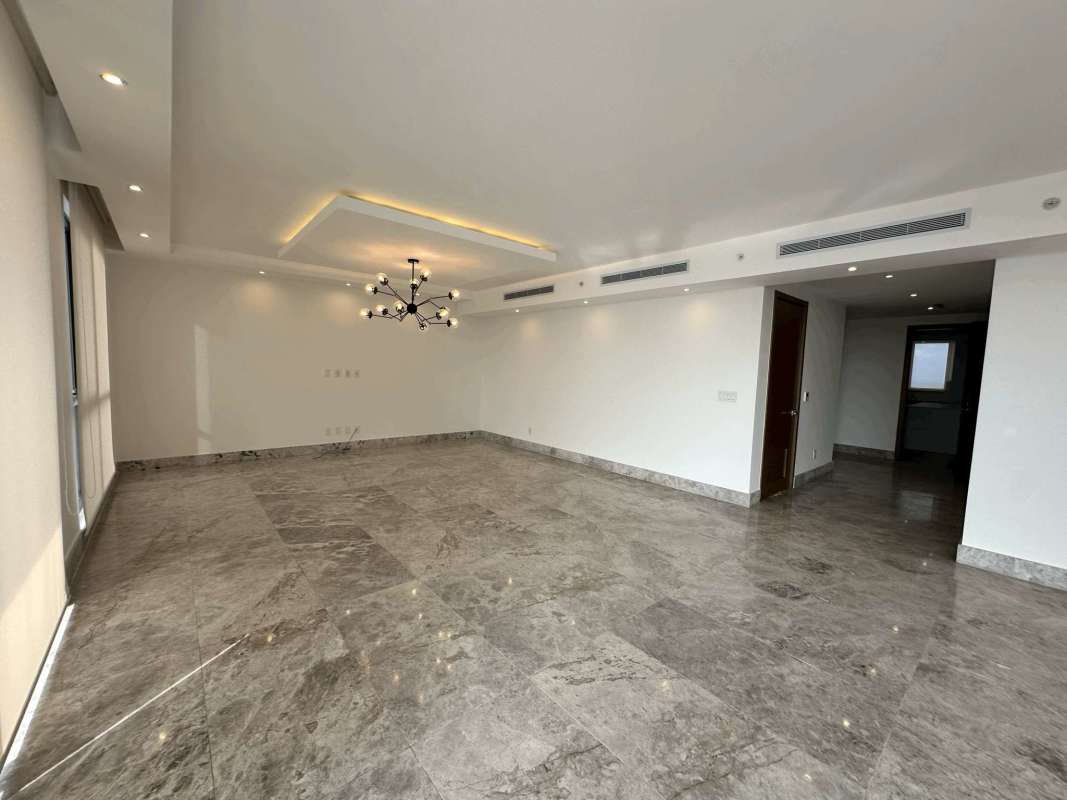 Marble floors, floor-to-ceiling windows in living room with balcony Empire Residences Santa Maria Panama