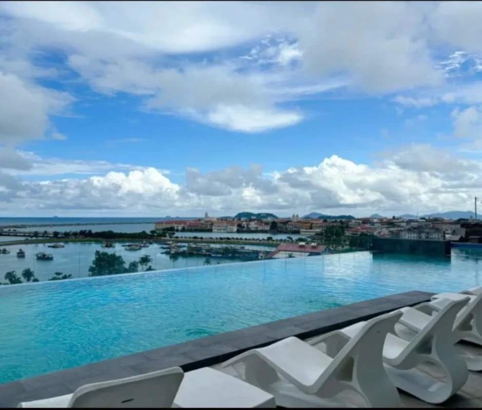 Rooftop infinity pool with skyline and Pacific Ocean views at BICSA Tower Avenida Balboa Panama