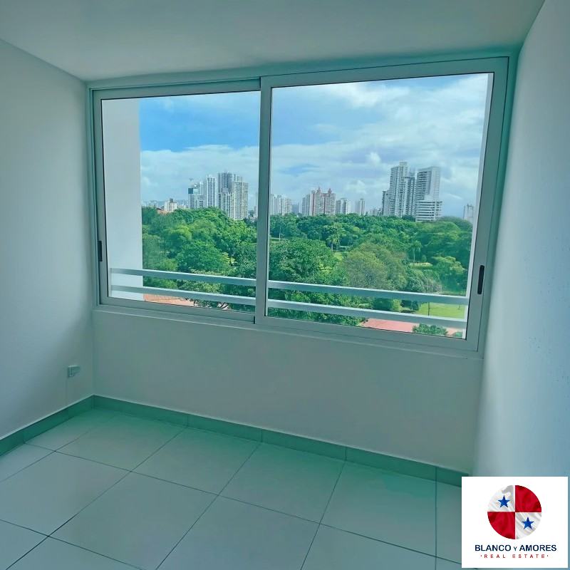 Bright modern living room opening to balcony with skyline and park view in PH Park View 67 Panama City