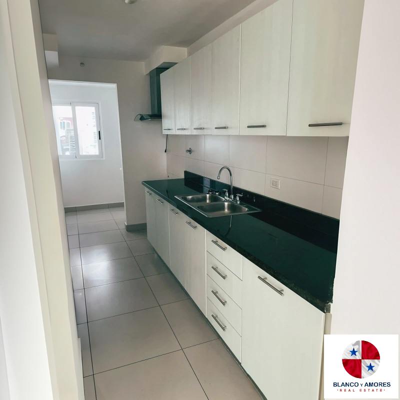 Bedroom with large windows overlooking park skyline in PH Park View 67 Panama City