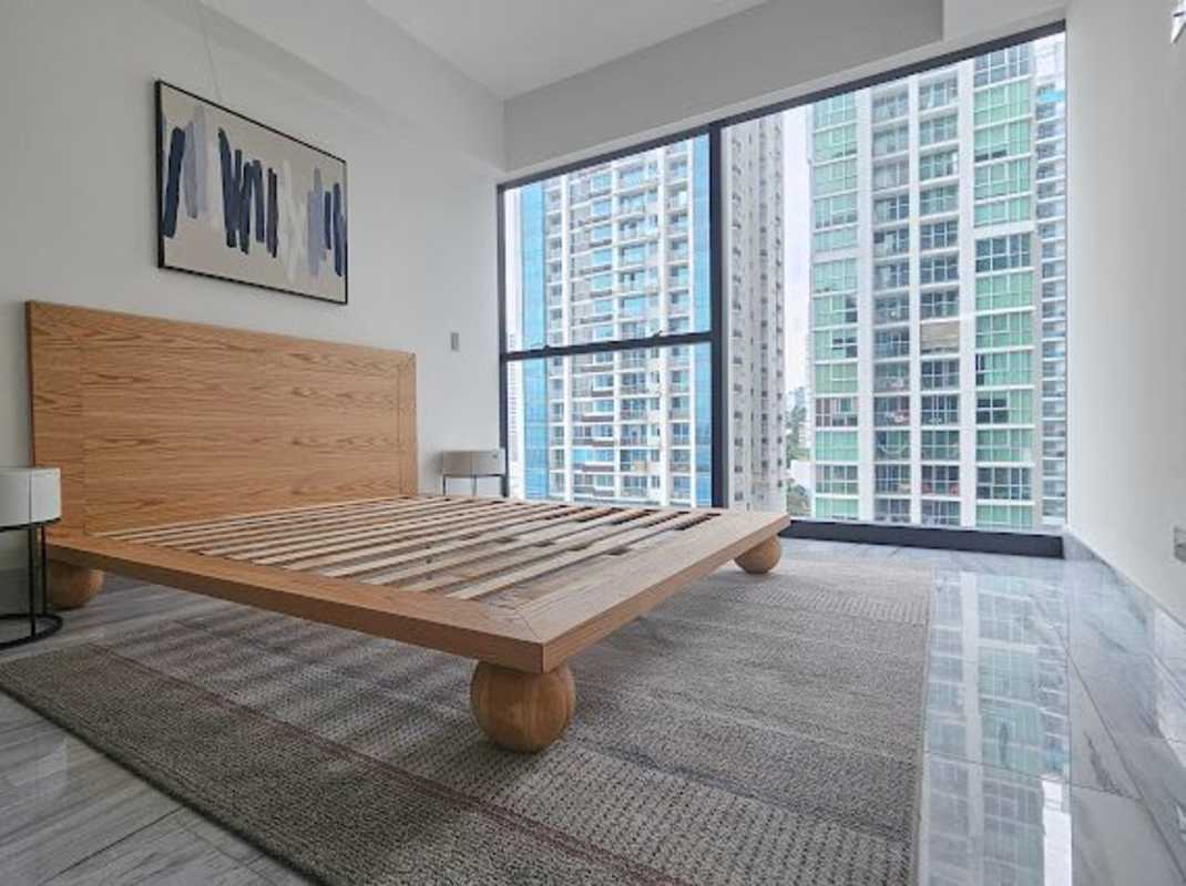 Modern second bedroom with skyline view and large closet in PH BICSA Panama apartment for rent