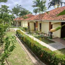 Tropical resort swimming pool area with gazebo and gardens at PH Las Palmas Panama