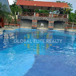 Pool area with shaded gazebo, gardens and deck in PH Las Palmas Rio Hato