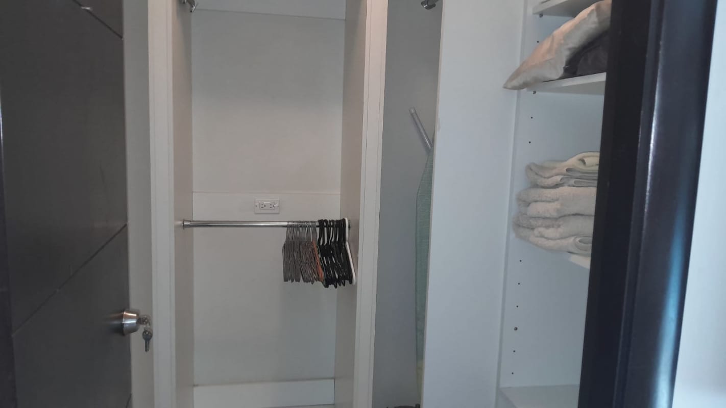 Spacious bedroom with large windows, ocean view, and modern furnishings in Bayfront Tower Panama City