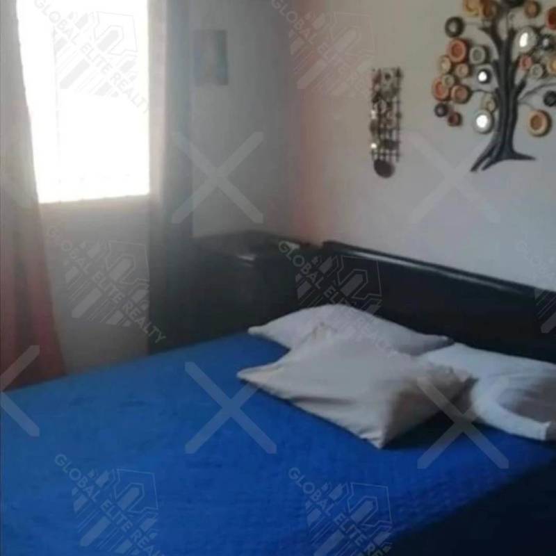 Bedroom with natural light and blue bedding in Praderas San Antonio Panama