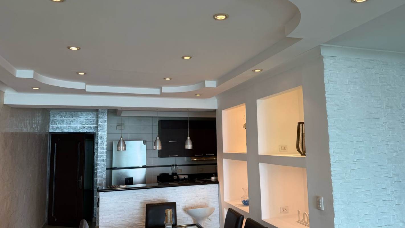 Open concept kitchen and dining with ocean view in Punta Paitilla apartment