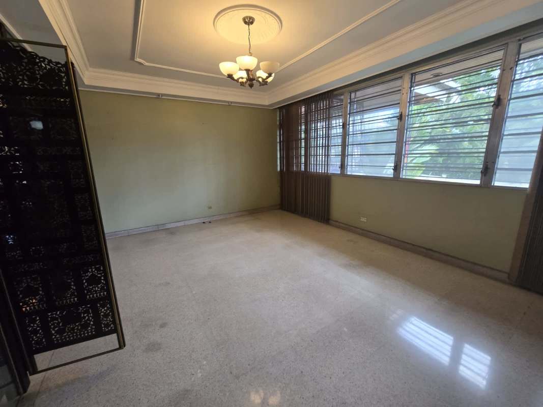 Large backyard with private swimming pool and tropical landscaping in Bella Vista Panama single-family home