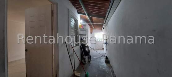 Covered parking with tiled roof and gated entrance single family house Panama