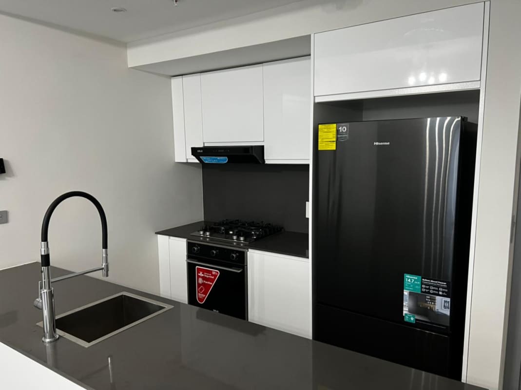 Bright second bedroom with city skyline view at Nuovo by Armani Casa Panama