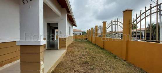 Spacious living and dining area with tiled floors and large windows in La Chorrera house
