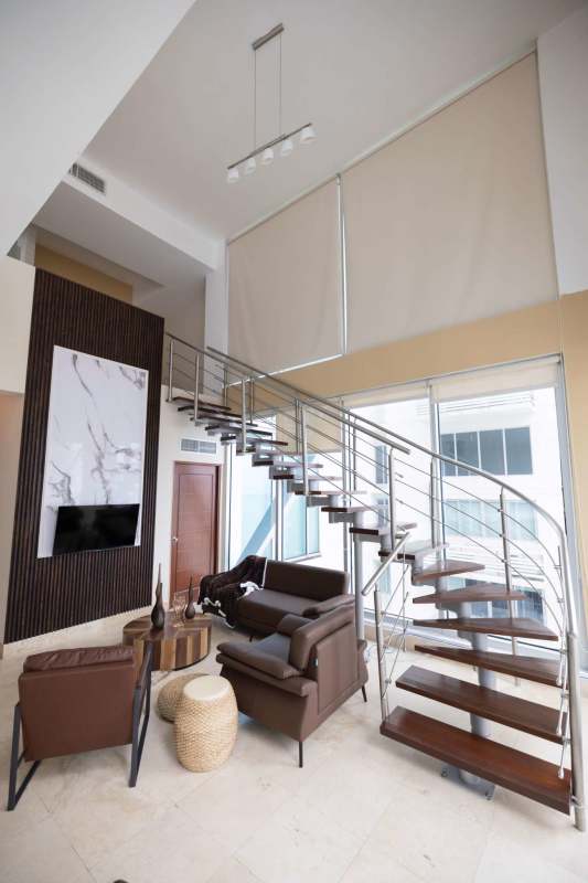 Contemporary kitchen with stainless steel appliances in furnished loft apartment for rent Panama City