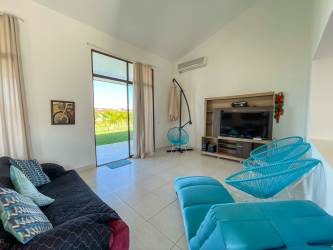 Bright open living and dining area with tile floors in house for sale Piedras Gordas San Carlos Panama