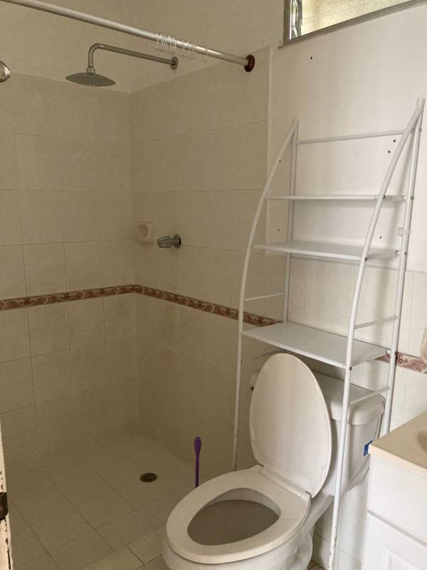 Bedroom with ceiling fan, tiled floor and closet in Vista del Valle house