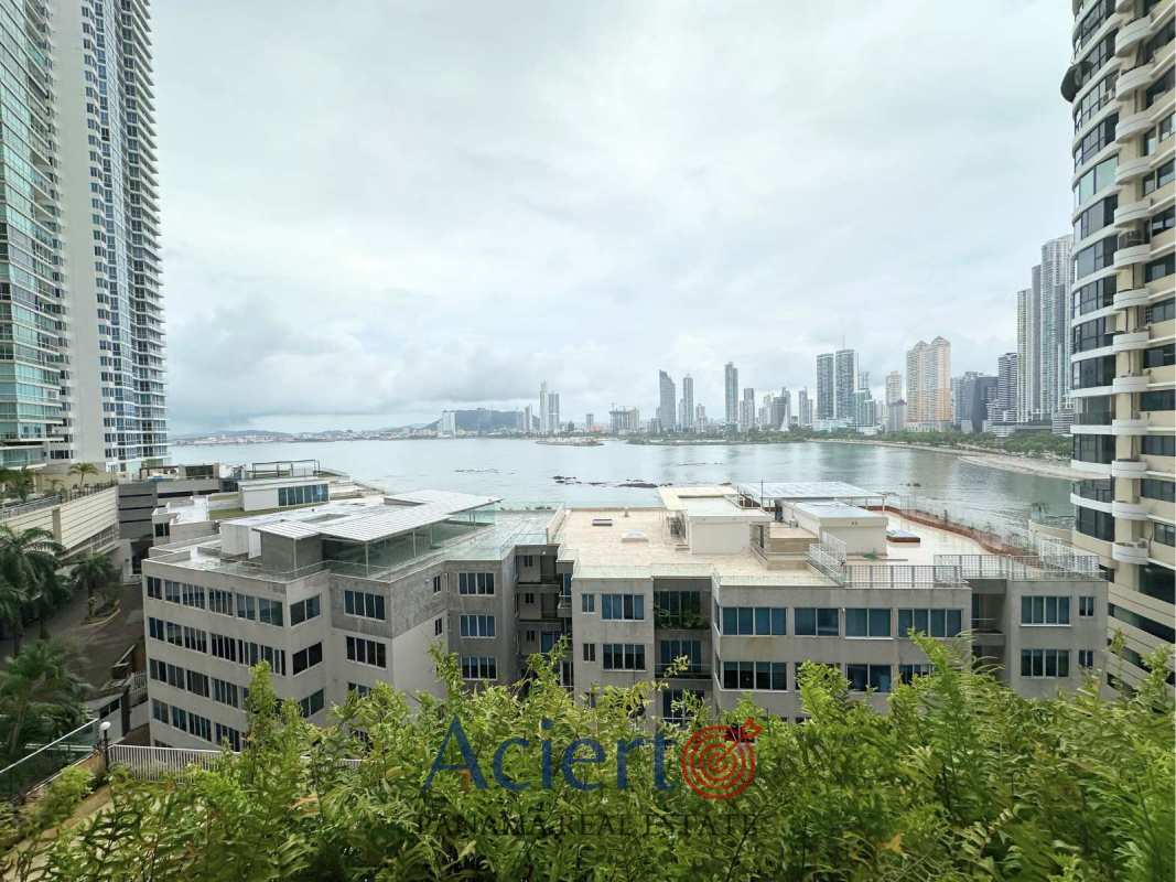 European design kitchen with white cabinetry, granite countertops and ocean view, PH Punta Paitilla.