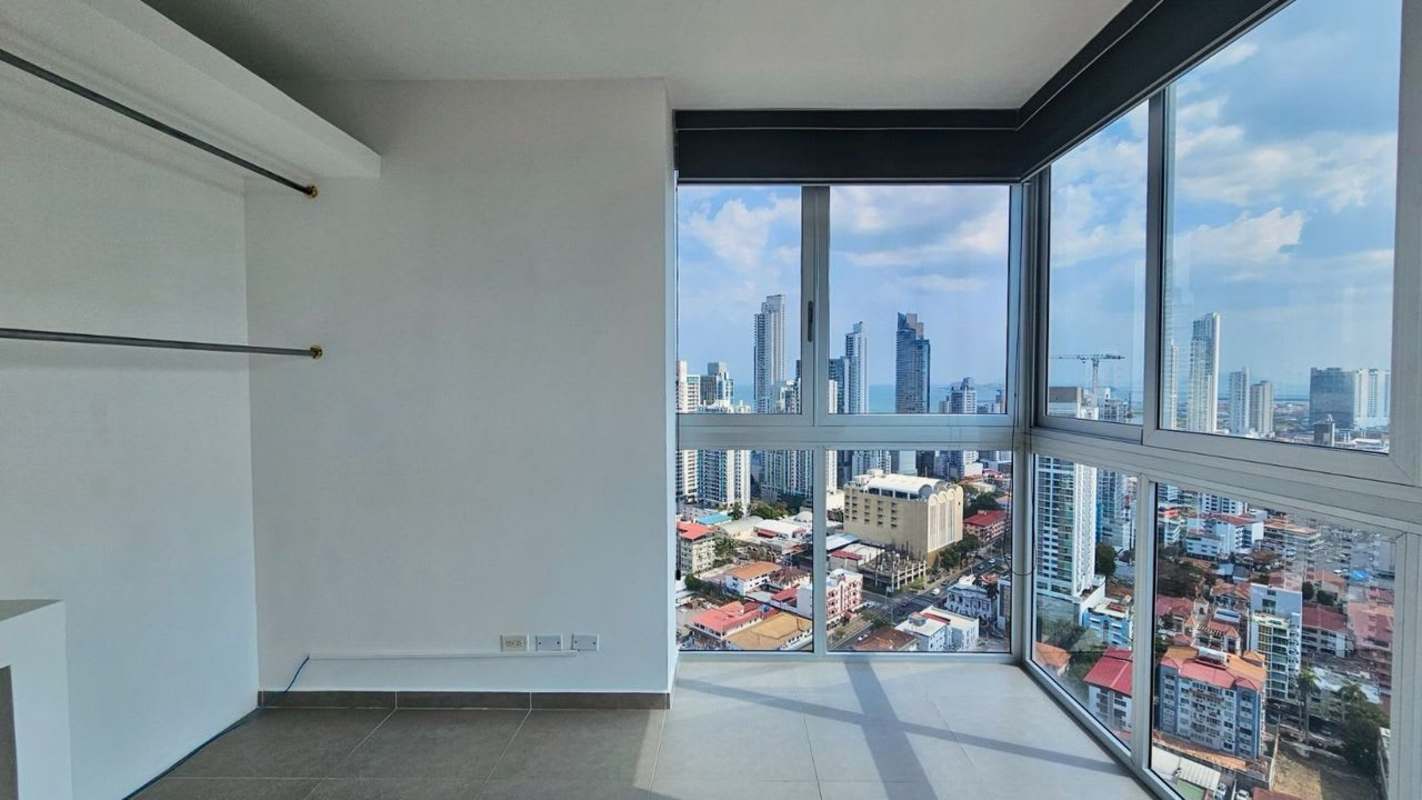 Floor-to-ceiling glass windows corner view skyline and mountains PH La Cresta Tower