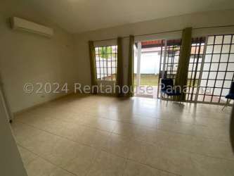 Large living room with glass sliding doors, minimal decor, tiled floors Los Pinos Arboledas La Chorrera Panama