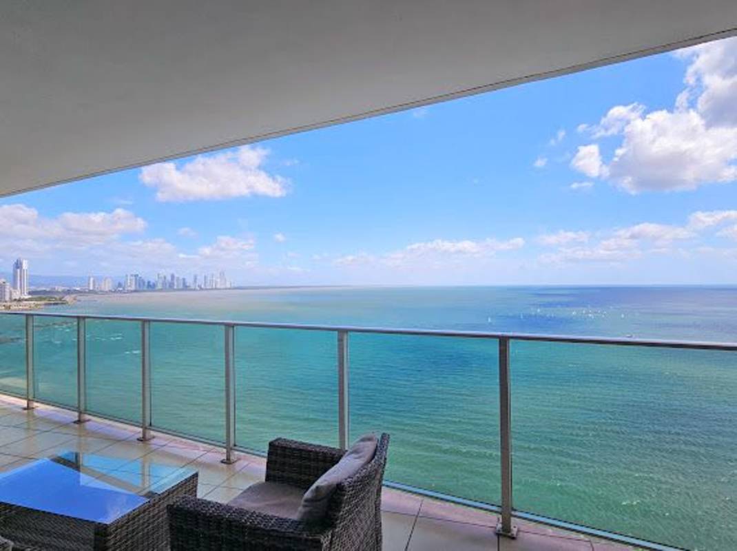 Spacious balcony with ocean and city skyline views in Trump Tower