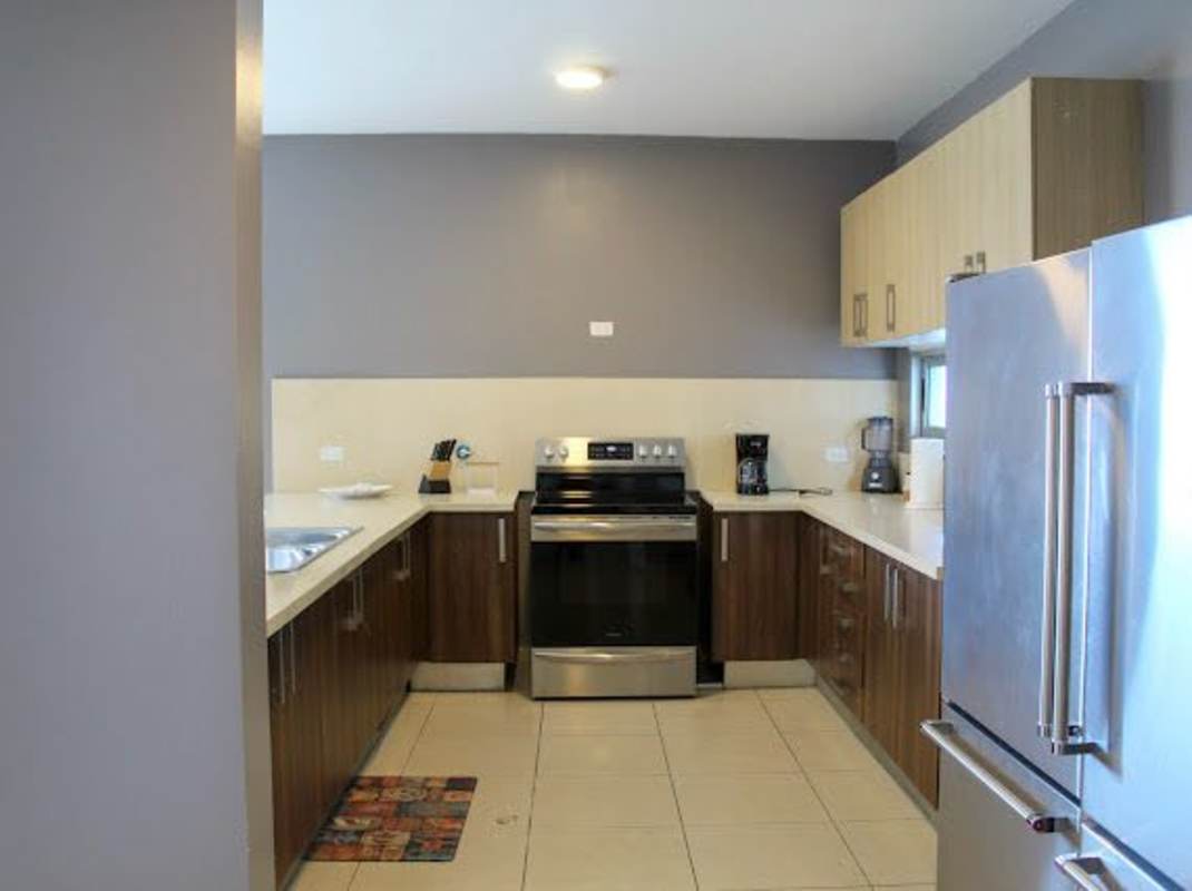 Furnished bedroom with queen bed and city views Trump Tower Panama