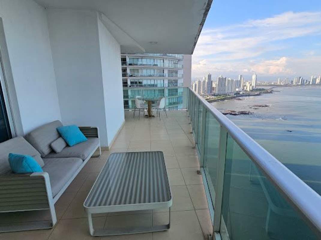 Large balcony offering oceanfront and city skyline views at PH Ocean Club Punta Pacifica Panama