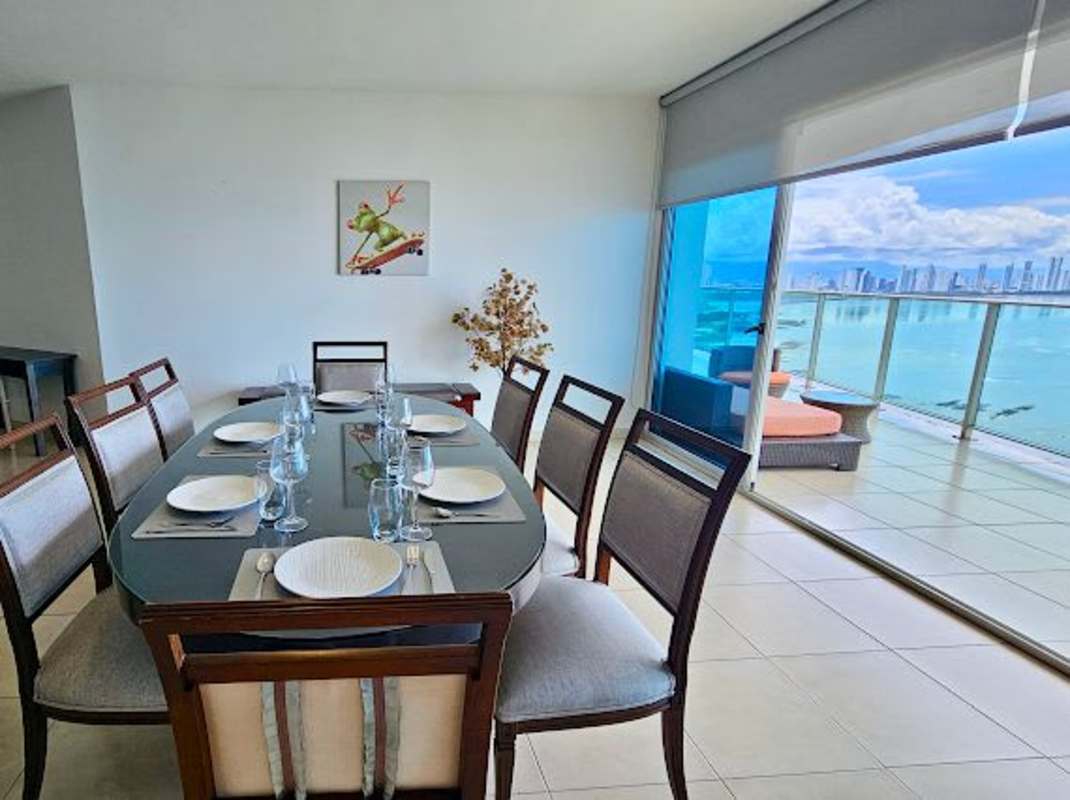 Large living area with sectional sofa, tile floors and ocean views in PH Ocean Club Punta Pacifica