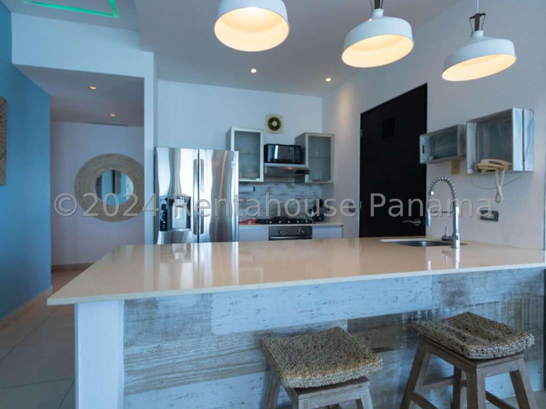 Modern kitchen with granite counters, large island, stainless appliances and sea view in PH Destiny Tower Avenida Balboa Panama City