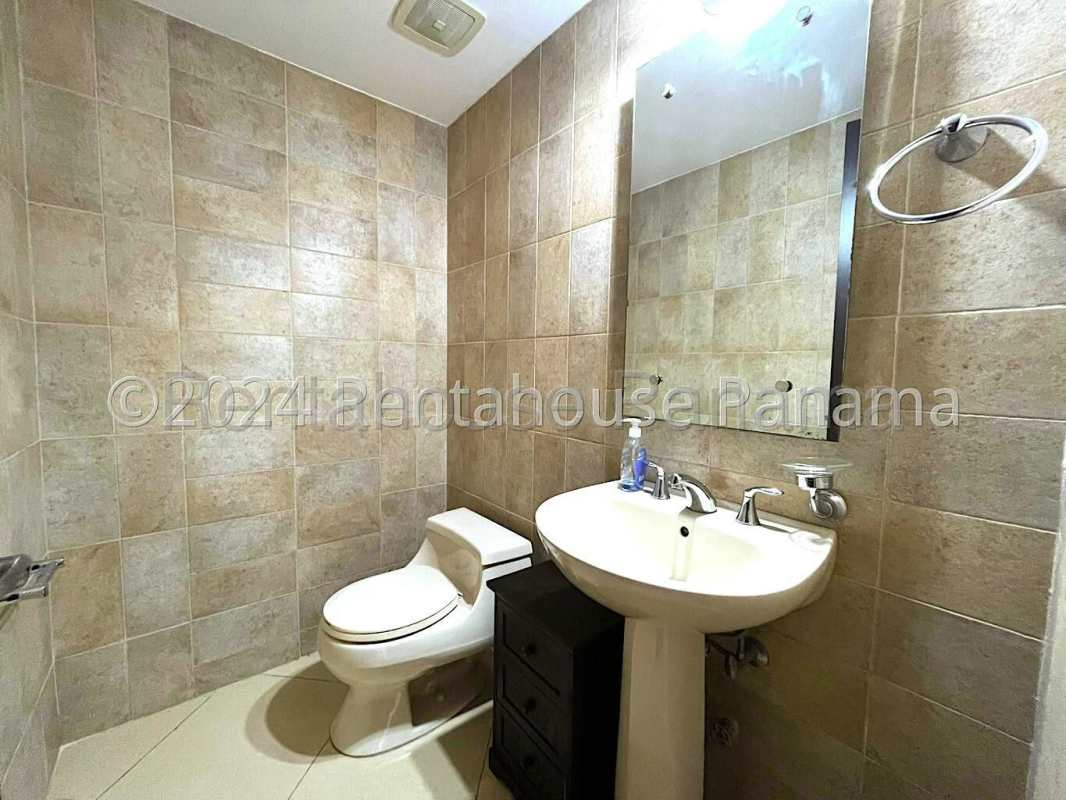 Bright living and dining room with ceiling fan Embassy Club Clayton rental Panama