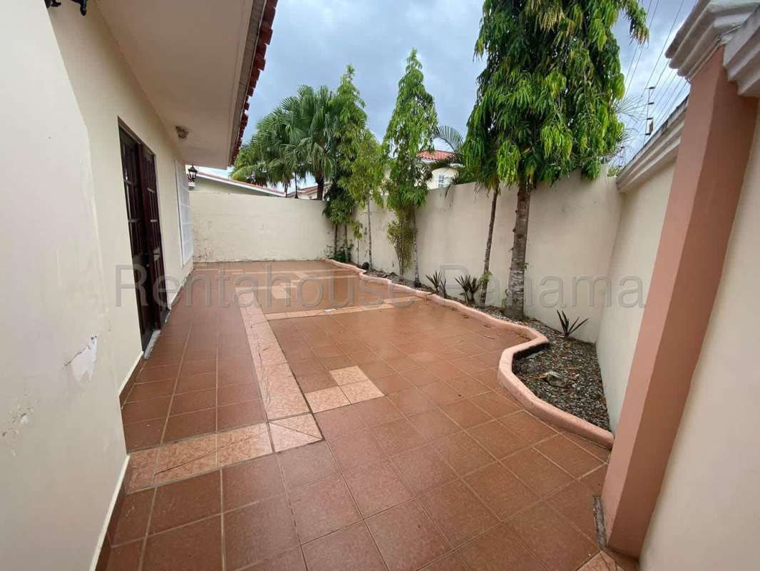 Bright living dining space with tile floors, natural light in Costa Sur house Panama