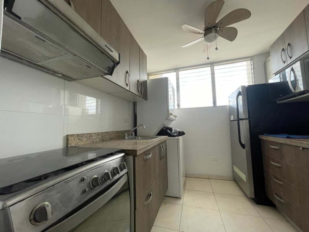 Bedroom with built-in wardrobe, ensuite bathroom and tiled floor in Llano Bonito Panama apartment