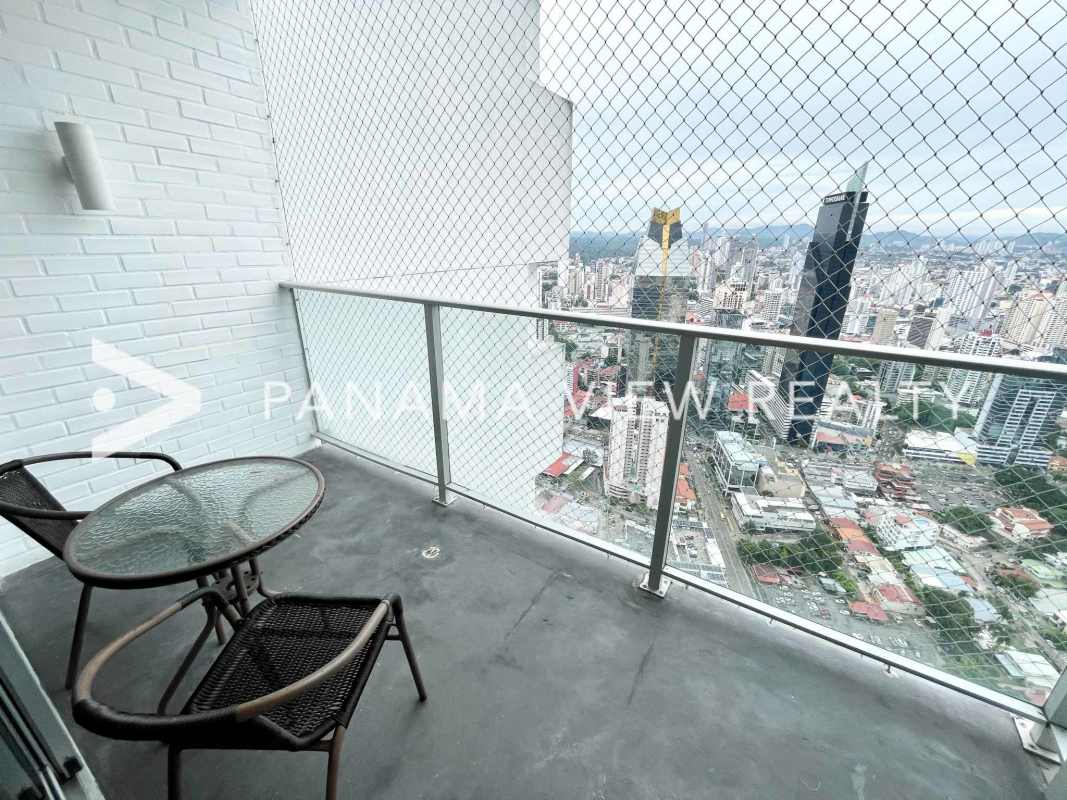 Second bedroom with built-in closet and skyline views PH Waters Avenida Balboa Panama