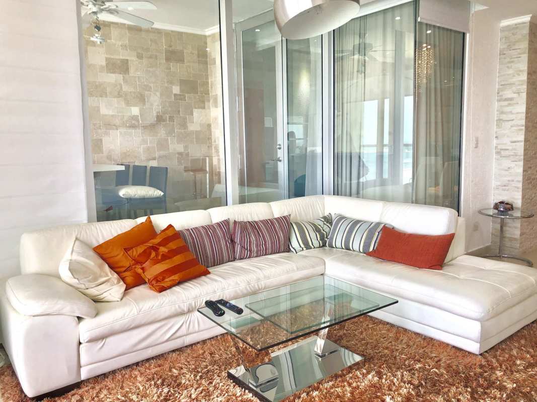 Modern living room with sectional sofa and stunning ocean view balcony PH Rivage Panama