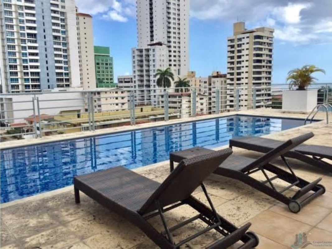 Rooftop pool with lounge chairs and skyline view at PH Famagosta Loft San Francisco Panama
