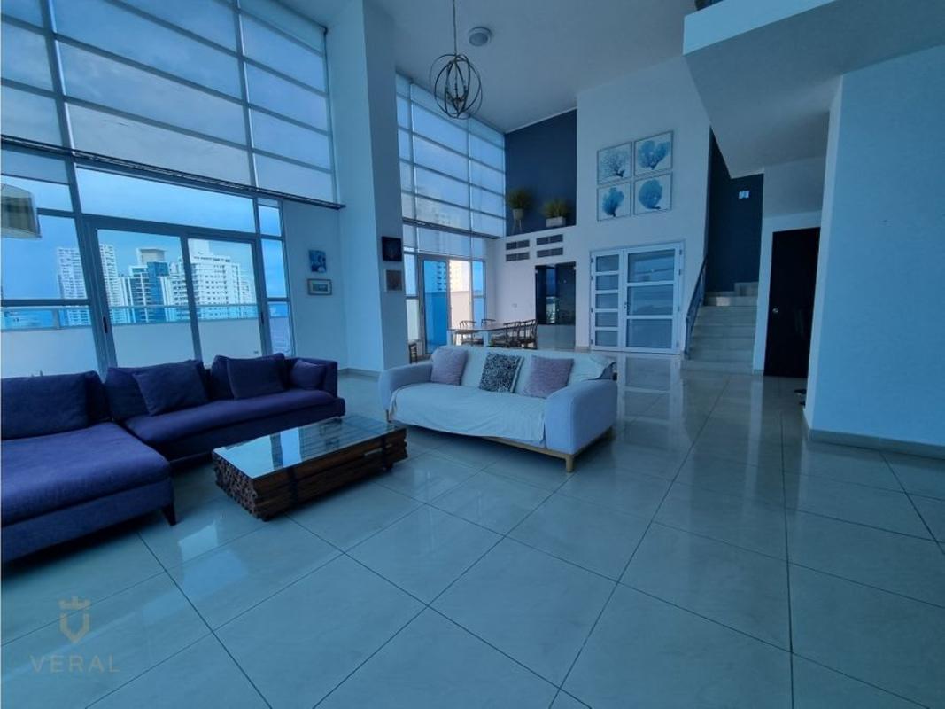 Living room with high ceilings, panoramic windows, contemporary furniture in PH Famagosta Loft Panama