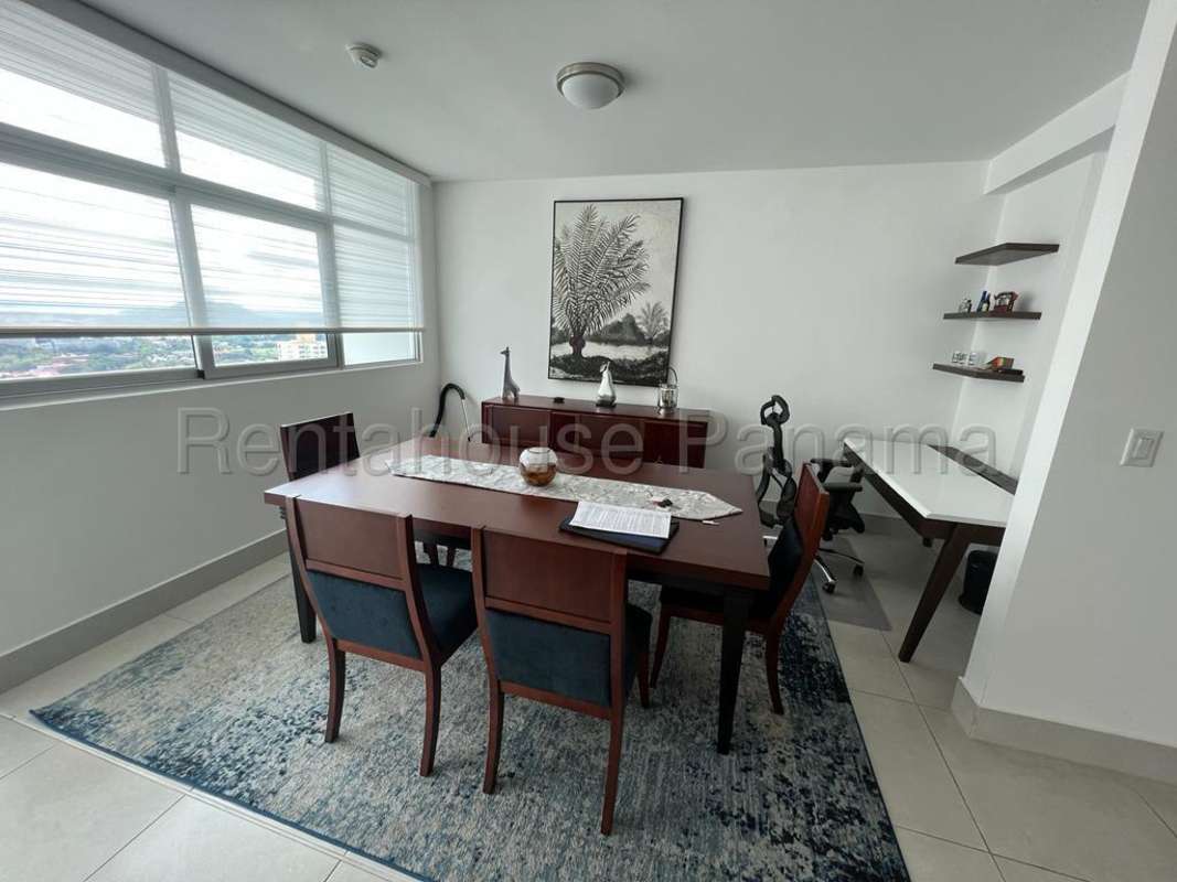 Modern dining room with city view and home office space at Vivendi Green Panama