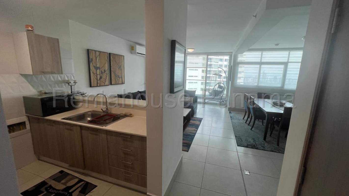 Open kitchen living and dining area furnished with large windows Vivendi Green Panama