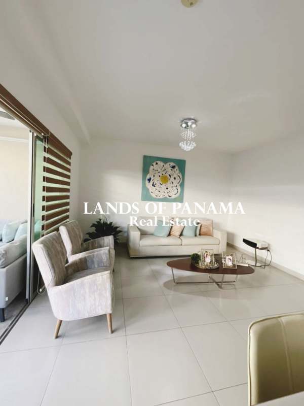 Spacious kitchen with granite counters, double sink, and cabinetry in Altos del Parque Betania Panama