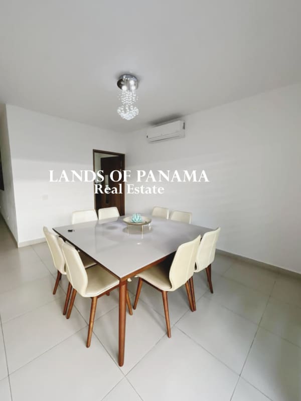 Stylish dining room with chandelier and split AC unit in Altos del Parque Panama City home for sale