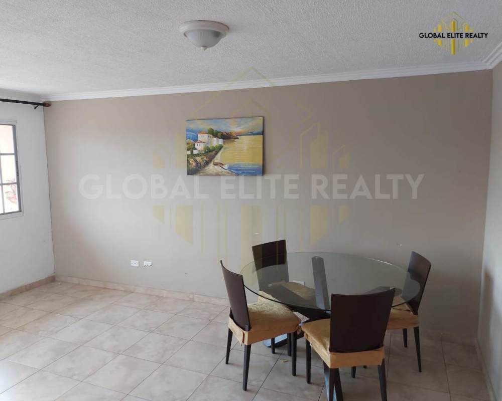 Small private balcony with tiles, railing, decor wall at Villa Lucre Condo Panama