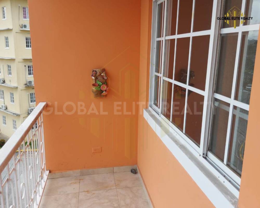 Bedroom with large window, closet, and tiled floors in Villa Lucre Condominium Panama