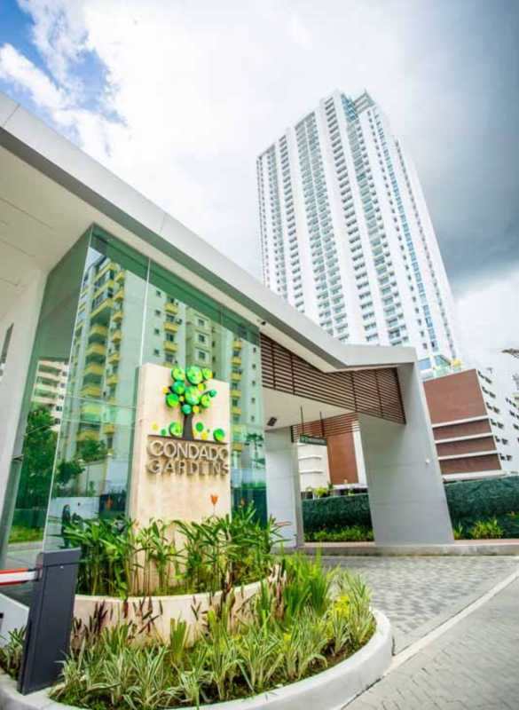 Main gate entrance and high-rise facade of PH Condado Gardens Condado del Rey Panama