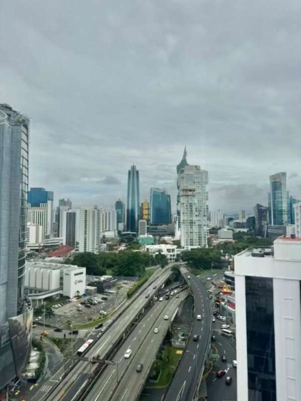 Skyline view with ocean and skyscrapers in Punta Paitilla Panama City Panama